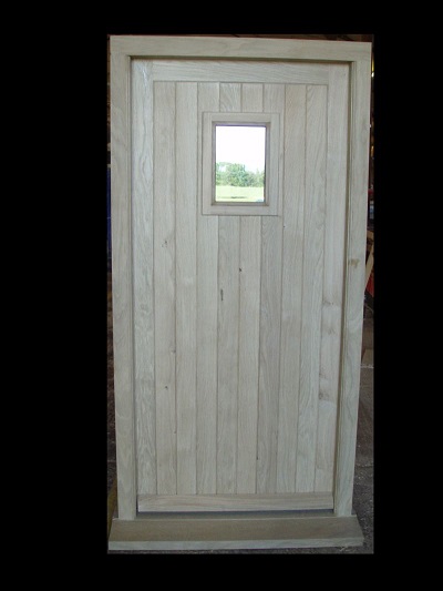 Ledge and brace door and frame with vision panel