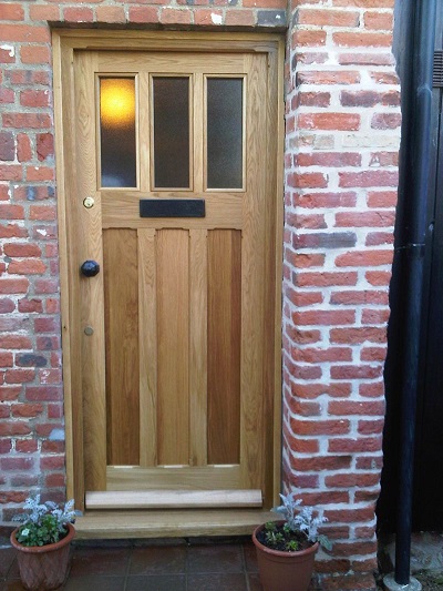 oak triple panel door with obscure glazing finished with oil