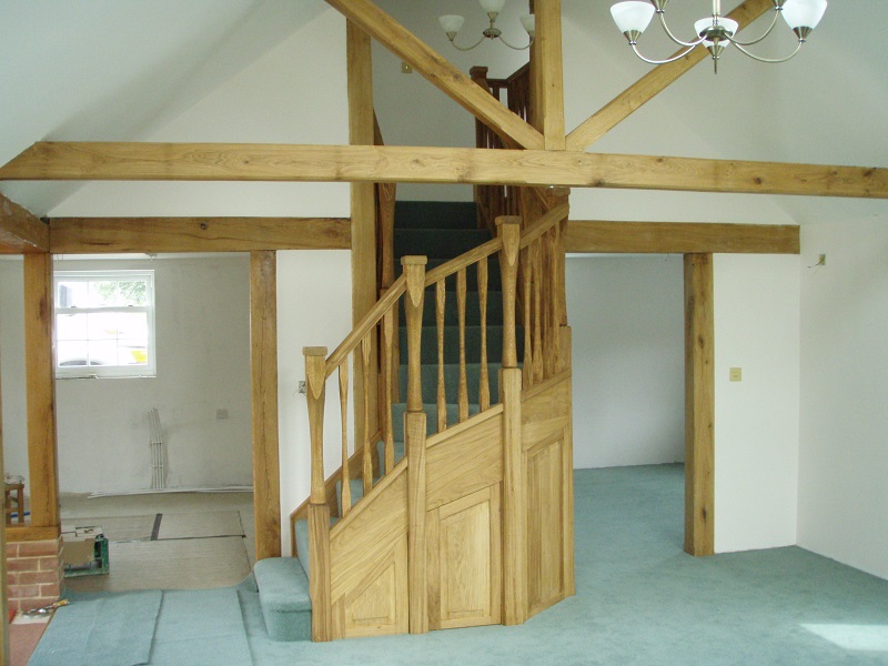 Oak staircase with slender style spindles and newels. Left wind. 4