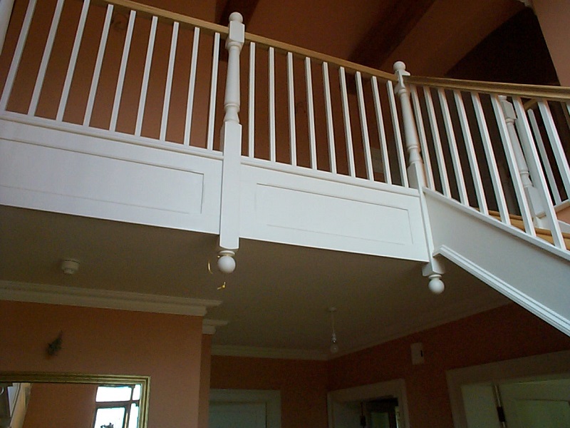 Victorian style staircase, painted white with hardwood handrail and ball newel caps