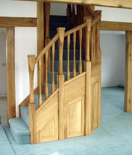 Oak staircase with slender style spindles and newels. Left wind. 2