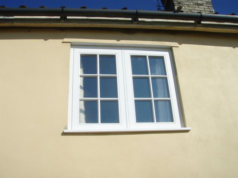 Double casement fully decorated white window