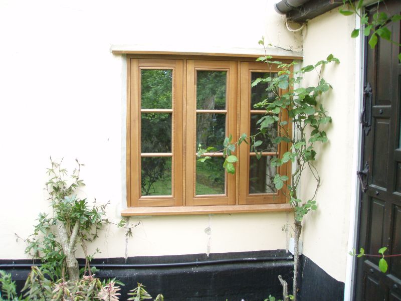 Triple casement stained timber window