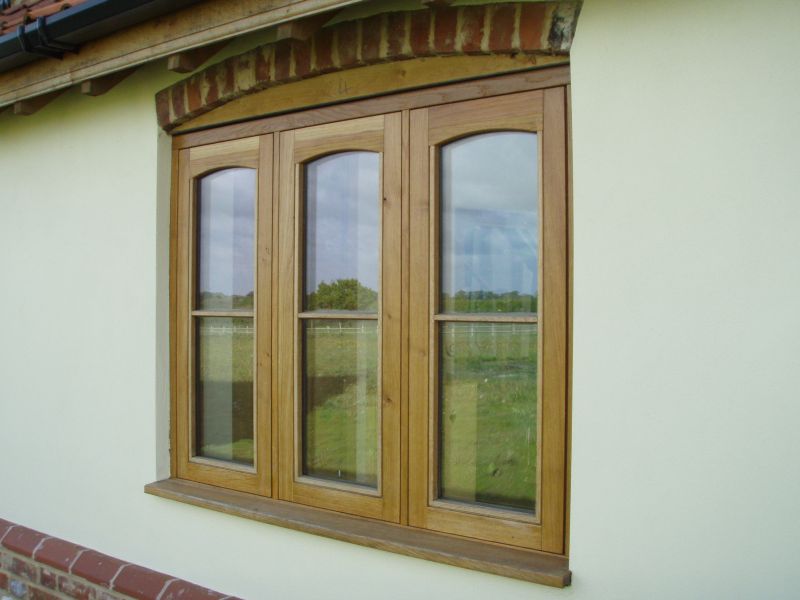 Stained triple casement timber window